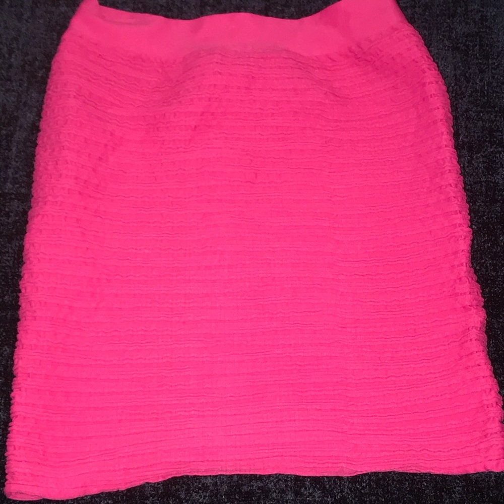 Stretchy pink mini skirt.